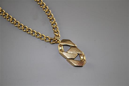 An unmarked heavy gold (tests as 9ct) curblink chain with large double curblink pendant, gross weight 95.9 grams.